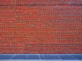 Weathered Exterior Brick Wall with Signs of Aging and Possible Water Damage