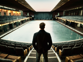 Contemplation at the Edge: A Lone Figure in an Empty Competitive Swimming Venue
