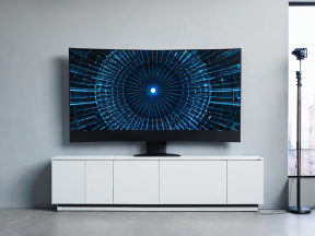 Modern Home Studio Setup Featuring Wall-Mounted Flat-Screen TV and Minimalist Entertainment Center