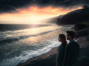 A Serene Sunrise: A Couple Embracing Nature’s Beauty on the Rocky Shore