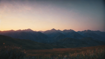 Tranquil Sunrise Over Snow-Capped Mountain Peaks
