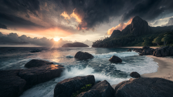 Sunset Serenity: Jagged Cliffs and Roaring Waves at Dawn