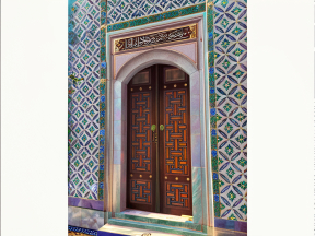 Intricate Islamic Tilework and Arabic Calligraphy Adorning a Historic Doorway