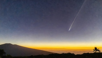 Shooting Star Over a Serene Island Landscape at Twilight