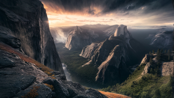 Sunrise Over Rugged Mountain Valley: Nature's Resilience in Harsh Terrain