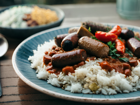 Hearty Mixed Rice Dish with Meat, Beans, and Fresh Herbs
