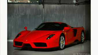 Sleek Red Ferrari Sports Car Parked in Private Garage Facility