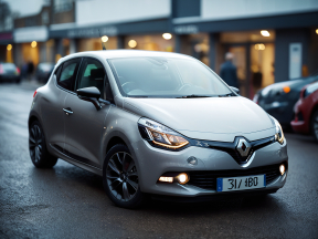 Silver Renault Hatchback Parked in Urban Street Setting