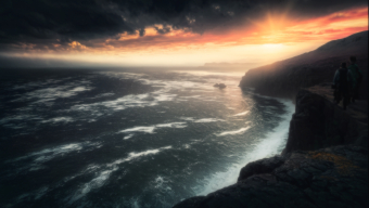 Solitude Amidst the Storm: A Dramatic Seaside Sunrise
