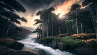 Serene Bamboo Waterfall Amidst Mountainous Sunrise: A Tranquil Fantasy Landscape